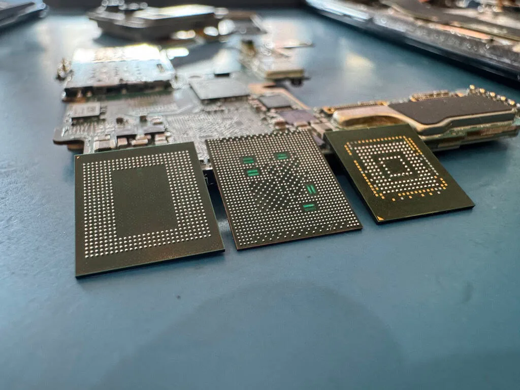 Close-up of NAND flash memory packages desoldered from a FireCuda NVMe SSD board on the data recovery bench during chip-level recovery